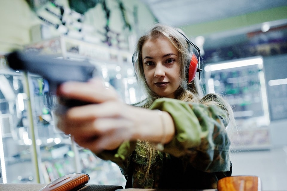 woman firing gun