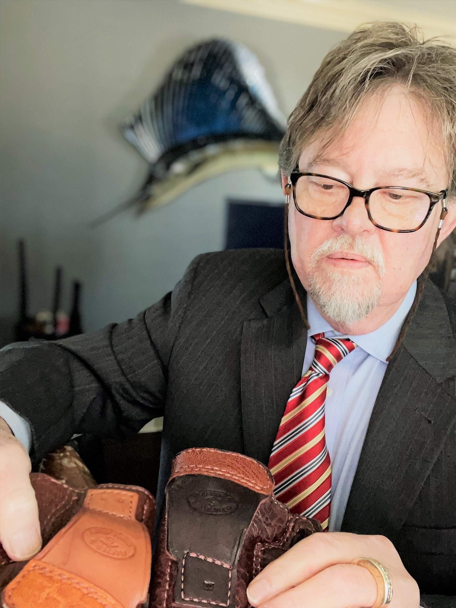 Author wearing outside waistband holsters illustrating leather contact and carry position