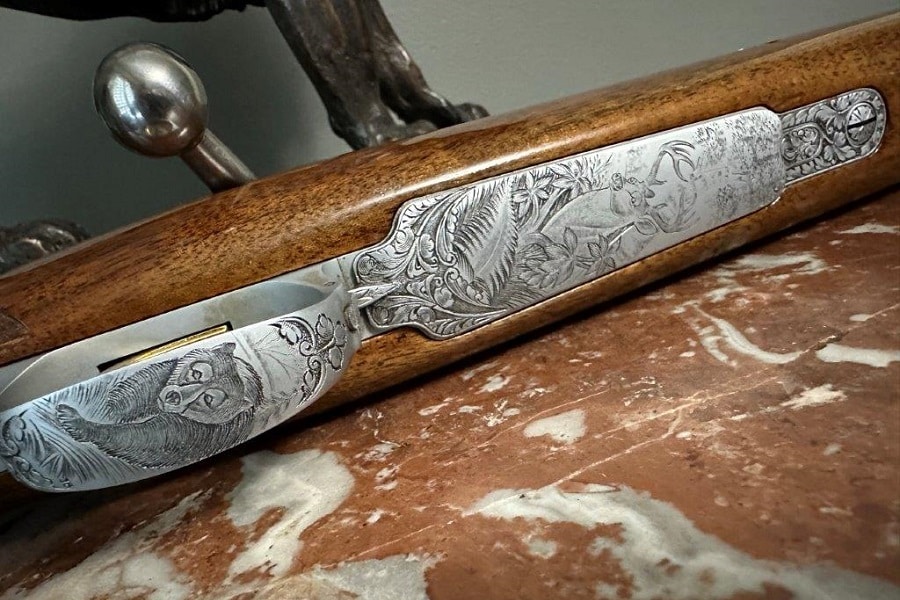 Closeup of engraved bolt-action hunting rifle