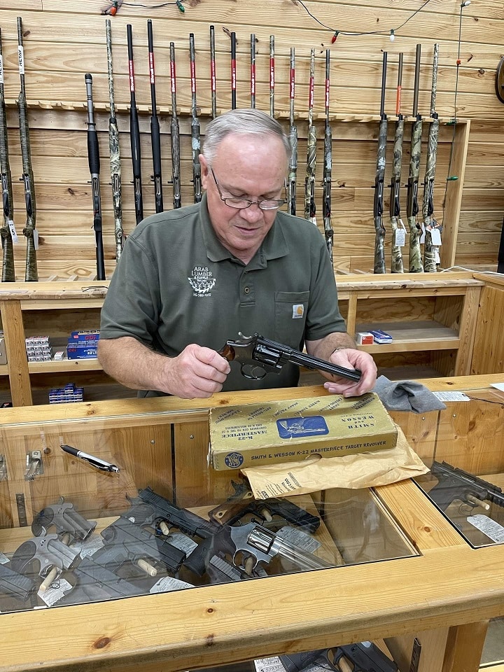 Benny inspecting one of the Smith & Wesson K-22 revolvers