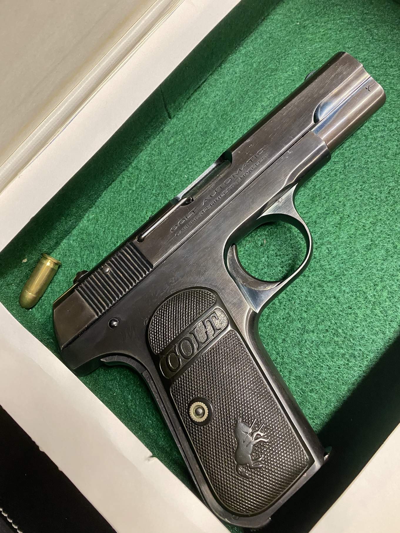 1903 Colt Pocket Hammerless stored in fake book