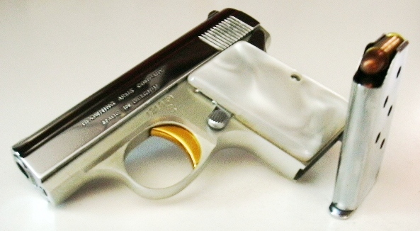 Baby Browning pistol and accessories
