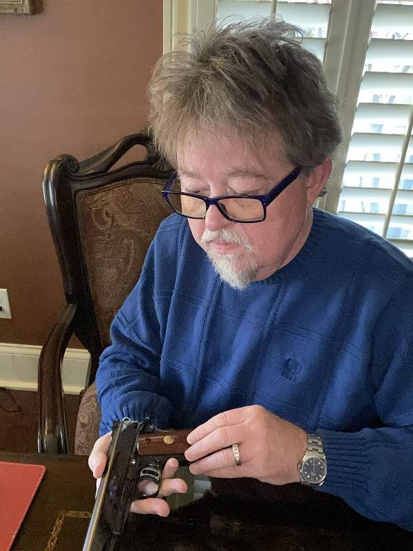 Greg inspecting the Colt Gold Cup