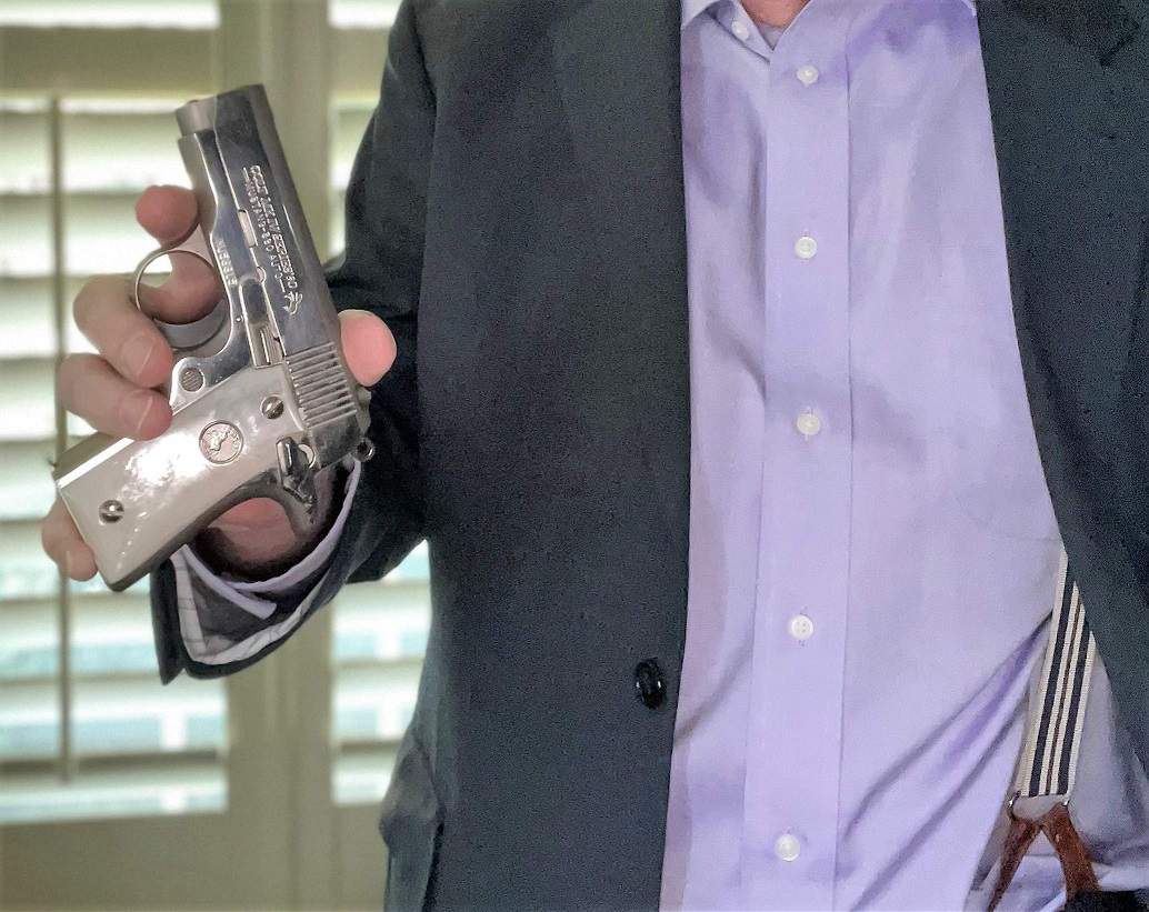 Author holding .380 Colt Mustang semi-automatic pistol
