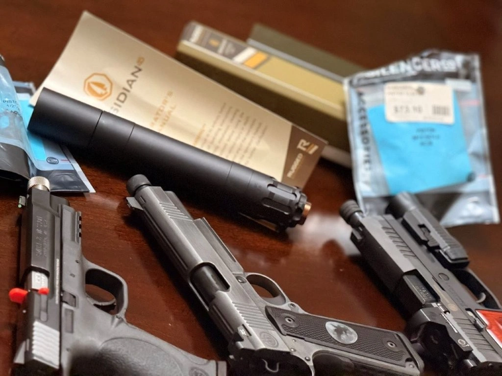 Rugged Obsidian .45 suppressor and paperwork context